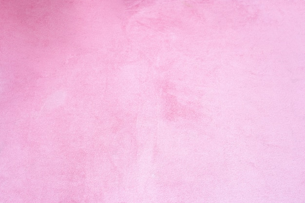 Cerca de textura de fondo de tela de terciopelo rosa, suave textil rosa pastel