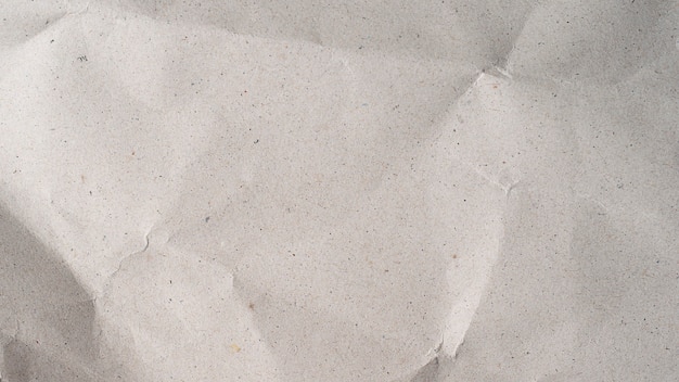 Foto cerca de textura de papel arrugado gris reciclado para el fondo