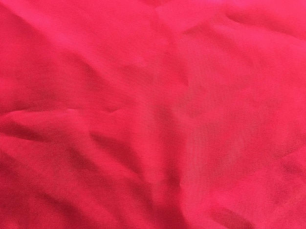 Cerca de una textura textil de tela roja