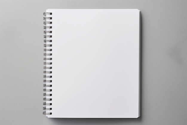 Cerrar cuaderno blanco con espacio de copia sobre fondo gris