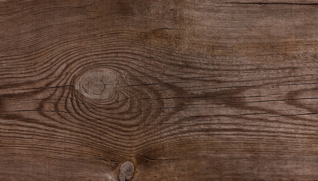 Cerrar la textura de fondo de la superficie de madera marrón degradado vintage con nudos y manchas