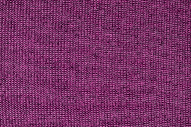 Cerrar la textura de la tela de tapicería de tejido grueso púrpura Fondo textil decorativo
