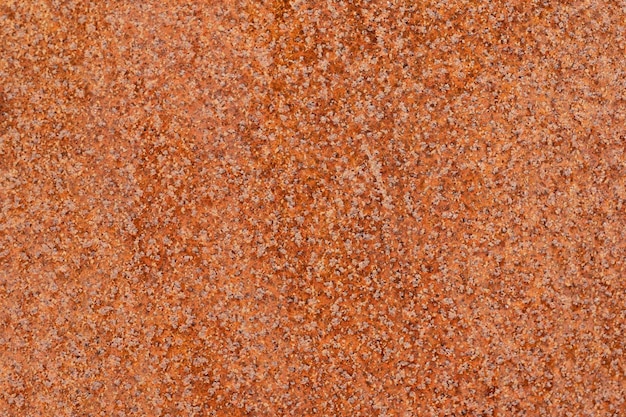 Cerrar vista macro de superficie de metal oxidado viejo moteado color amarillo naranja patrón detallado textura o