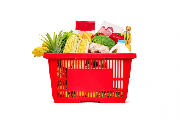 Cesto de compras vermelho cheio de comida e mantimentos