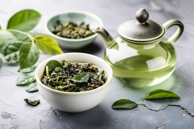 Foto chá verde oolong em uma chaleira e tigela