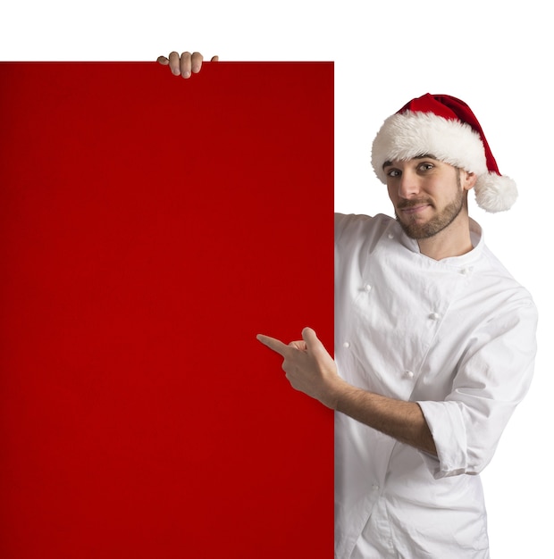 Chef muestra un cartel rojo de Navidad