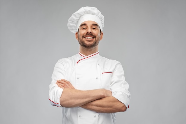Chefe de cozinha feliz e sorridente em Toque