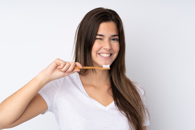 Foto chica adolescente con un cepillo de dientes