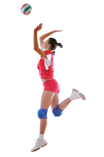 Foto una chica jugando al voleibol.
