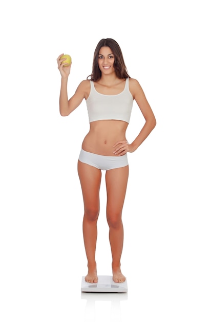 Foto chica en ropa interior con un pesaje de manzana