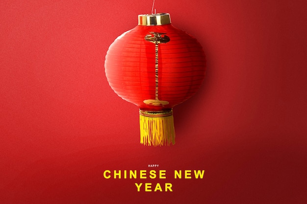 Chinesische Laternen, die mit einem farbigen Hintergrund hängen. Frohes chinesisches Neujahr