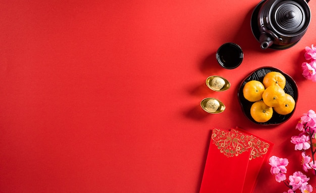 Chinesische Neujahrsfestdekorationen pow oder rotes Paket, orange und Goldbarren