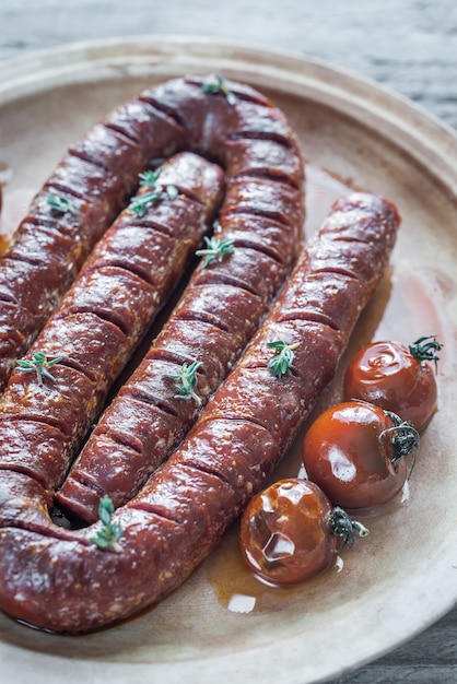 Chorizo asado con tomates cherry