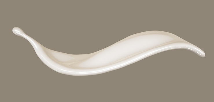 Foto un chorrito de leche.