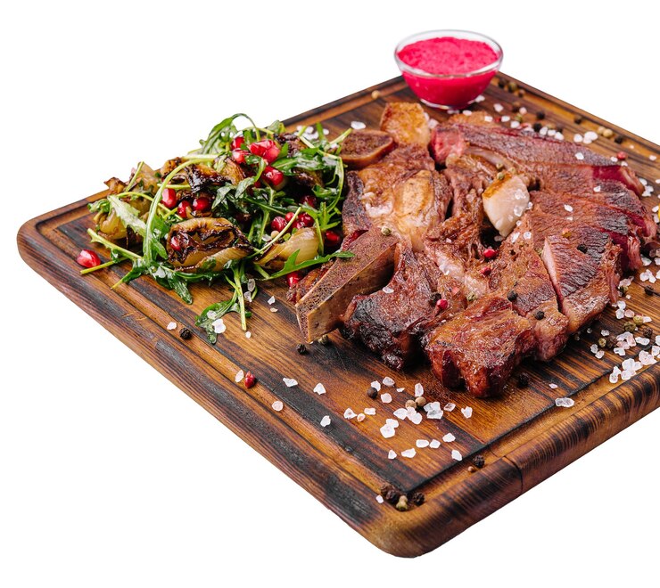 Chuleta de cerdo picante a la plancha con cebolla frita y rúcula