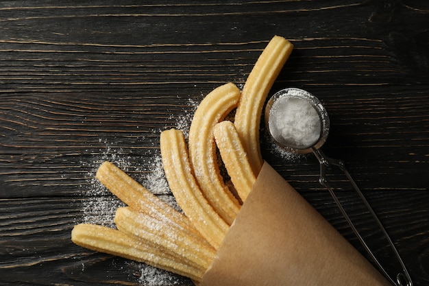 Churros doces e açúcar de confeiteiro