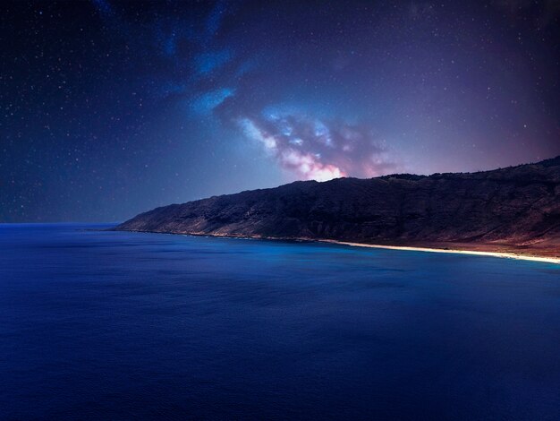 Foto el cielo estrellado de la playa por la noche diseño de collage