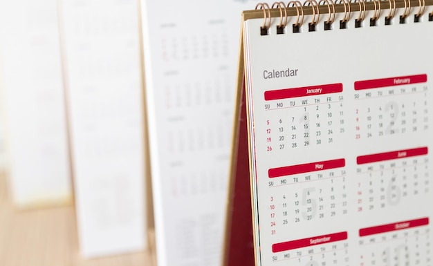 Cierre las fechas de la página del calendario y el concepto de reunión de cita de planificación empresarial de fondo del mes