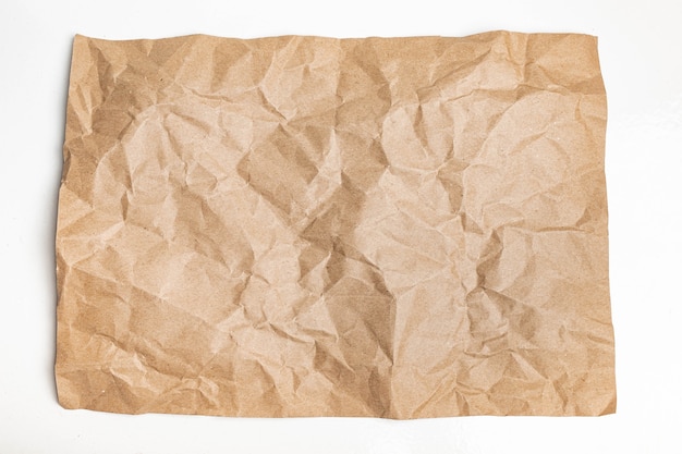 Ciérrese para arriba de arruga marrón reciclada arrugada vieja con el fondo áspero de la textura de la página del papel. pliegue grunge pergamino patrón diseño vintage