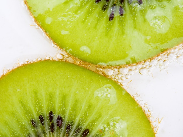 Ciérrese encima de fondo de la textura Fruta de kiwi.