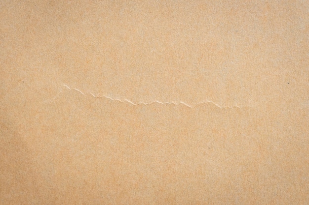 Ciérrese encima de textura y de fondo del papel marrón con el espacio.