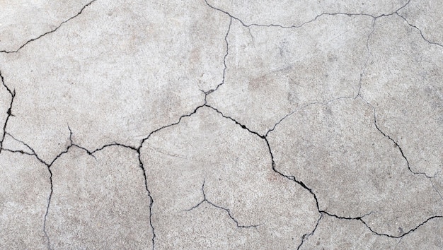 Cimento rachado ou textura de superfície de concreto para fundo