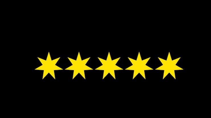 Foto cinco estrelas amarelas alinhadas horizontalmente sobre um fundo preto