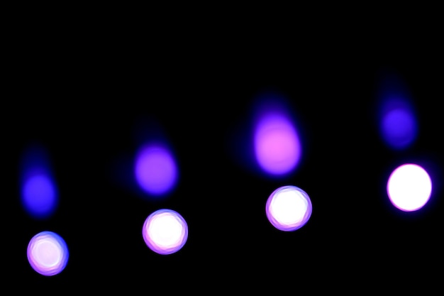 Círculos bokeh em fundo azul Holofotes desfocados