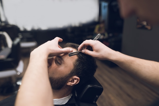 Close up Barber Male Hands Shave Client