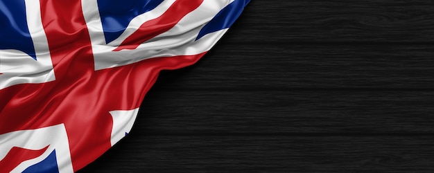 Close Up da bandeira do Reino Unido no fundo de madeira preto renderização 3D