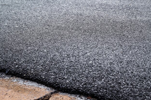 Foto close-up da nova textura de estrada de asfalto
