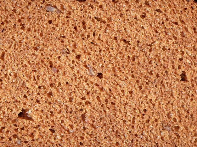 Close-up da textura do pão em fatias vista de cima da superfície do pão de trigo recém-cozido