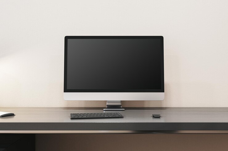 Foto close-up de interior de escritório de designer contemporâneo com monitor de computador vazio e outros itens mock up 3d rendering