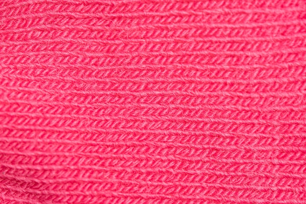 Foto close-up de malha de lã rosa textura