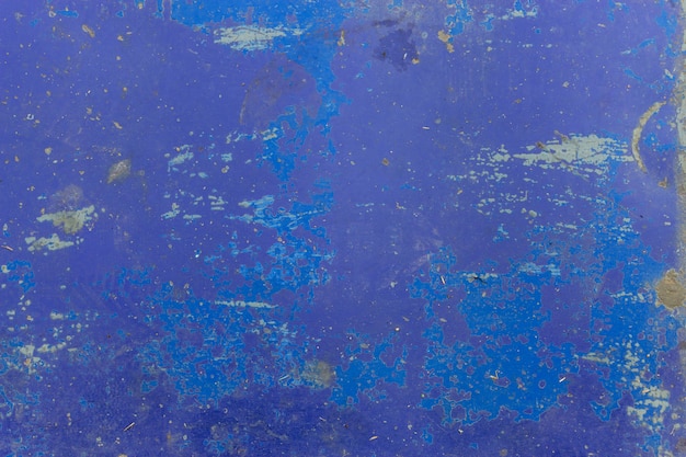 Close up de uma textura azul descascada da parede. fundo da vista superior