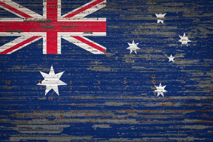 Foto close-up de uma velha parede metálica com a bandeira nacional da austrália conceito da austrália de armazenamento de mercadorias de exportação e importação e entrega nacional de mercadorias bandeira em estilo grunge