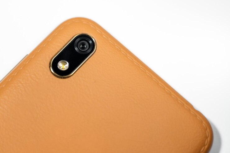 Foto close-up do módulo de câmera em smartphone marromcâmera de telefone móvellente de flash de câmera close-up