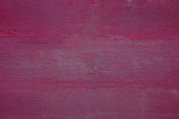 Close-up do velho purpure pintado com textura de madeira resistida.