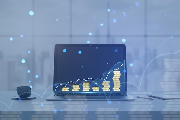 Close up del escritorio de la oficina con computadora portátil suministros de tazas de café y gráfico de negocios creativos y monedas apiladas en círculos bokeh borrosos de fondo Concepto de crecimiento financiero y comercio