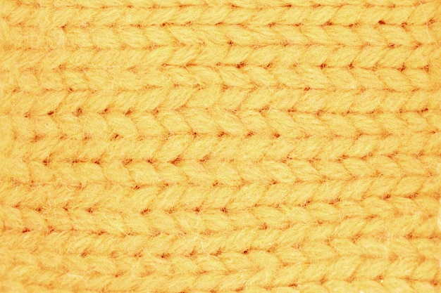Close-up na textura de malha de lã amarela