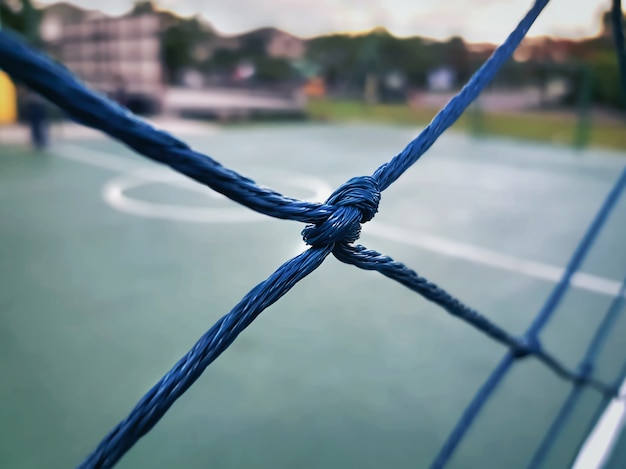 Close-up, nó, de, azul, rede, ao redor, pequeno, campo futebol