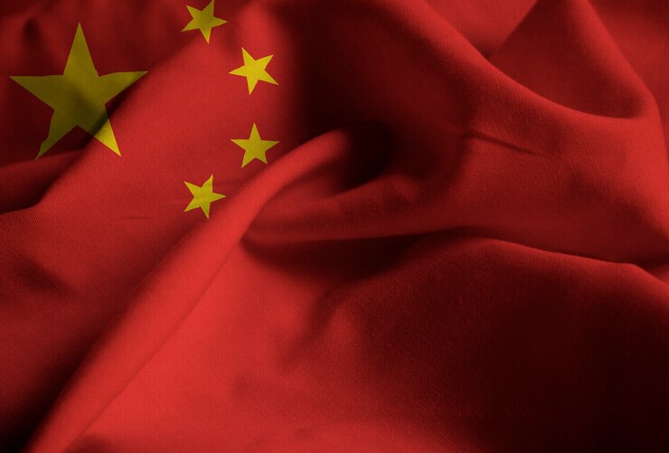 Foto closeup, de, babados, bandeira china, china, bandeira, soprando, em, vento