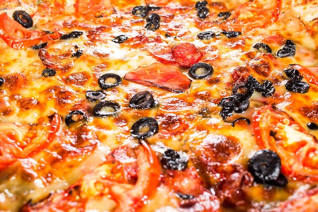 Closeup de pizza de fundo apetitoso preenchendo o quadro.