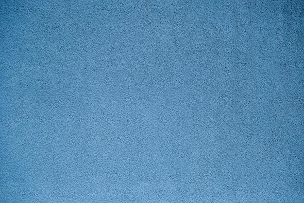 Closeup de textura de parede pintada de azul para fundo
