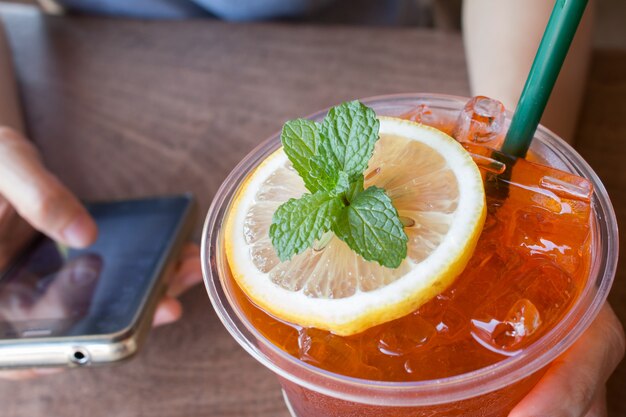 Closeup of Lemon ice tea on wooden table