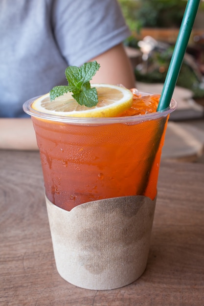 Closeup of Lemon ice tea on wooden table