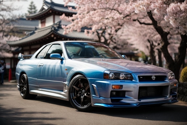Foto coche deportivo azul contra el fondo de las flores de cerezo