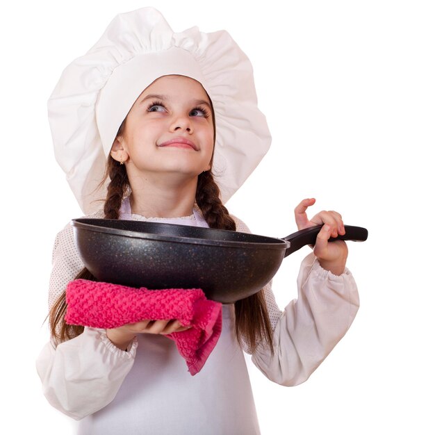 Foto cocinar y el concepto de la gente sonriendo niña en sombrero de cocinero con sartén