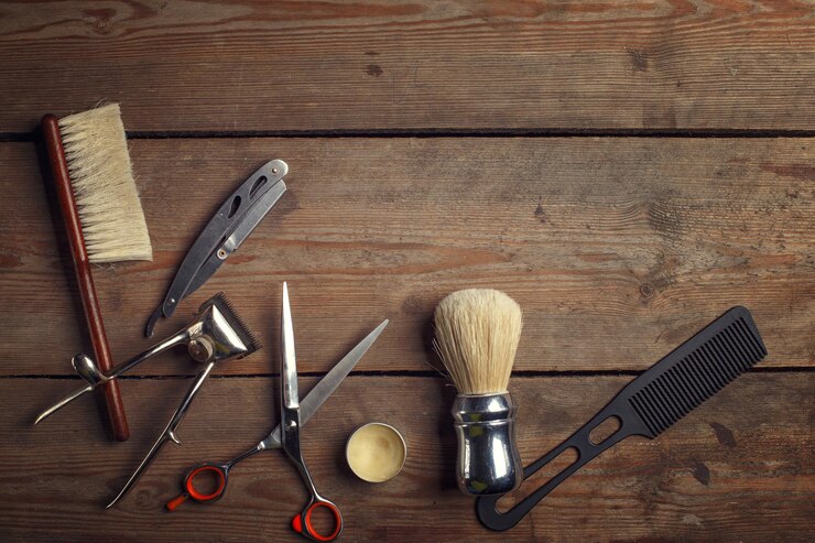 Foto coleção de ferramentas de barbearia com tesoura, pente, barbeadora e máquina de corte
