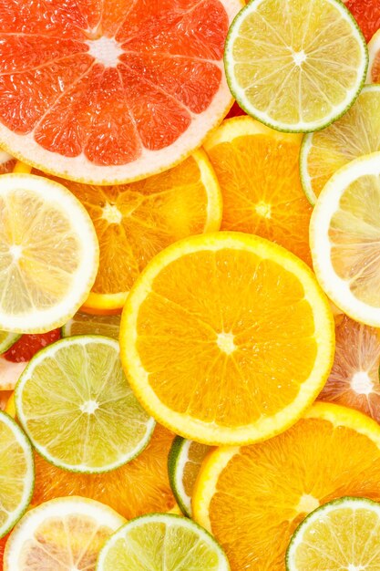 Foto coleção de frutas cítricas fundo de alimentos laranjas limões limões formato de retrato toranja frutas frescas
